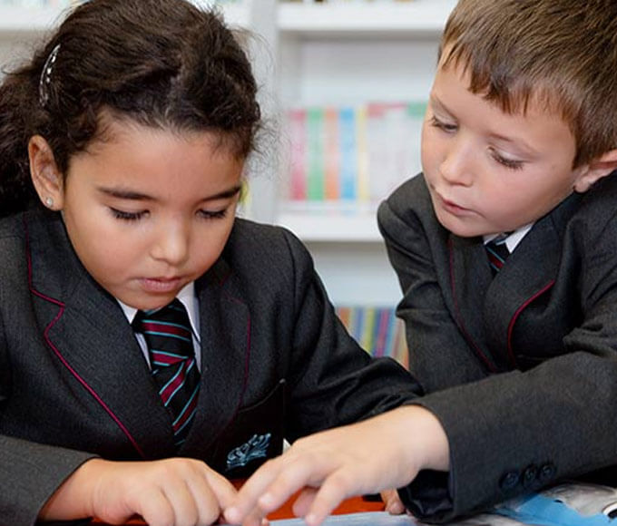 children-looking-at-assessments-block